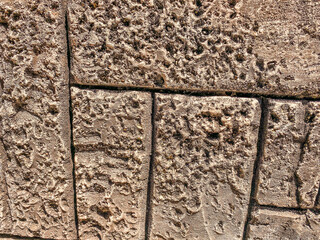 concrete masonry. large red bricks, texture, background. bricks with holes on the surface, porous material. volumetric texture