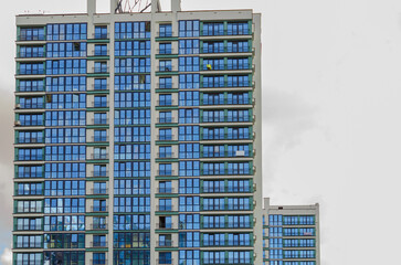 Contemporary high-rise apartment buildings, frame-block construction, ventilated glass facade.