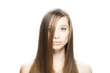 Naklejka premium Studio portrait of a beautiful brunette girl with positive face expression looking at camera...