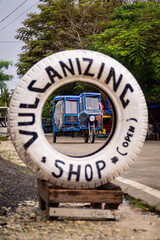 Tuk tuk in a tire on a philippine island Siargao - obrazy, fototapety, plakaty