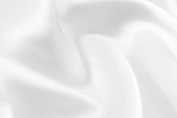 A twisted piece of white fabric. White material or texture with waves and folds. Wrinkled white...
