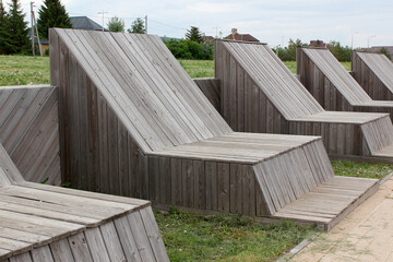 Wooden deck chairs in the park