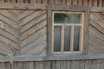 Obraz na płótnie Canvas Texture of a wooden wall with windows
