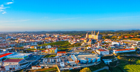 Fototapeta na wymiar Aerial view of the Palace of Mafra. Unesco world heritage in Portugal. Aerial top view of the Royal Convent and Palace of Mafra, baroque and neoclassical palace. Drone view of a historic castle.