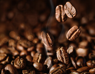 Brown Roasted Coffee beans closeup on dark Background