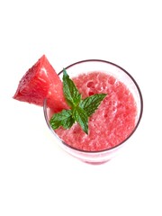 Watermelon smoothie and mint leaves on white background.