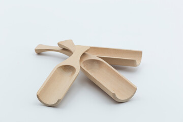 wooden shovels or bins on white background