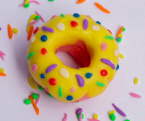 Yellow donut made with plasticine