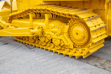 Continuous metal tracks of the bulldozer
