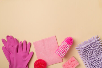 Many different house cleaning products on color background, top view.