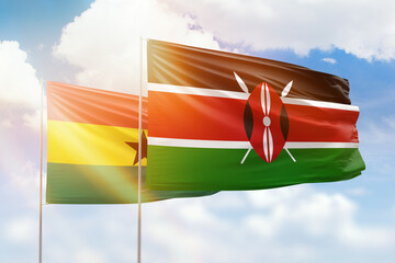 Sunny blue sky and flags of kenya and ghana