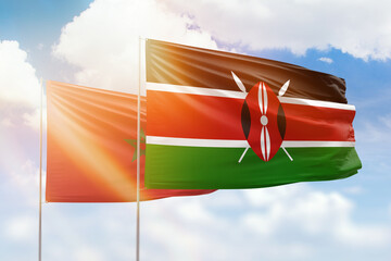 Sunny blue sky and flags of kenya and morocco