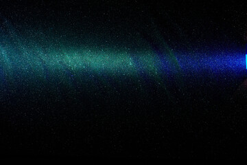 Fototapeta premium On a black grungy background in fine grain green and blue gradient beam of light