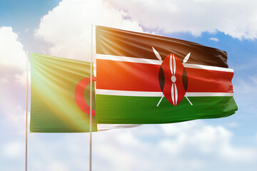 Sunny blue sky and flags of kenya and algeria