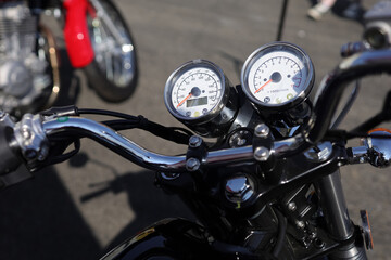 Plakat Detail of motorbike and motorcycle - Handlebar and speedometer. Shallow focus and very low depth of field.