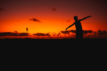 silhouette of a person in the sunset