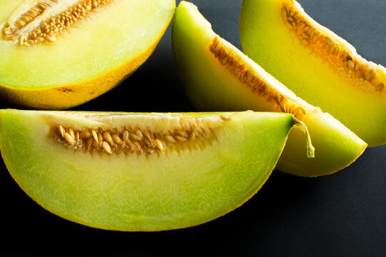 sliced ​​turkish melon on black background.