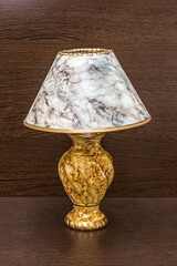 Marble-colored night light on a brown nightstand