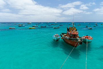 fishing boat on the clear sea water