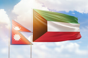 Sunny blue sky and flags of kuwait and nepal