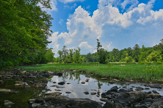 A Rocky River Landscape In The Forest With A Cloudy Blue Sky At The Haw River In North Carolina