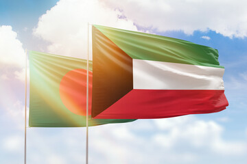 Sunny blue sky and flags of kuwait and bangladesh