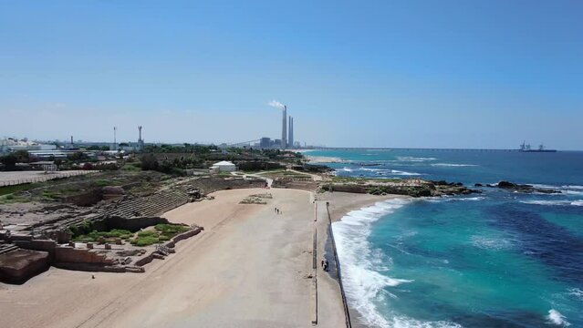 Caesarea Beach and archaeological site with electric chimneys, Aerial
Drone view over Mediterranean sea and  Caesarea Beach archaeological, site
