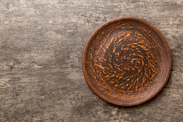 Top view of empty plate on cement background. Empty space for your design