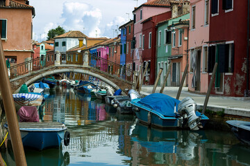Fototapeta na wymiar Arch Bridge Over Canal at Burano Island Italy in venetian lagoon