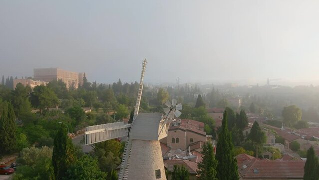 Montefiore Windmill with mist clouds, Jerusalem, Aerial
Montefiore Windmill also known as the Jerusalem Windmill and Yemin Moshe, at sunset, 2022, israel, drone view

