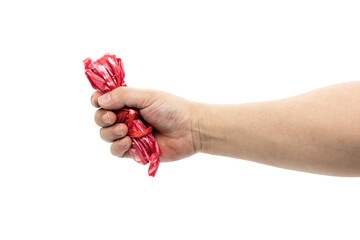 Hand holding a bundle of red nylon tying rope closeup isolated on white background