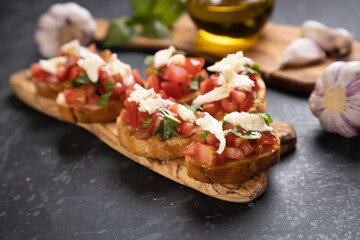 Italian bruschetta bread with tomato, basil and mozzarella cheese