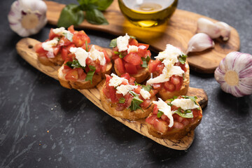 Italian bruschetta bread with tomato, basil and mozzarella cheese