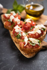 Italian bruschetta bread with tomato, basil and mozzarella cheese