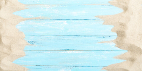 Sand on blue planked wood. Summer background. Flat lay, top view, copy space © prime1001
