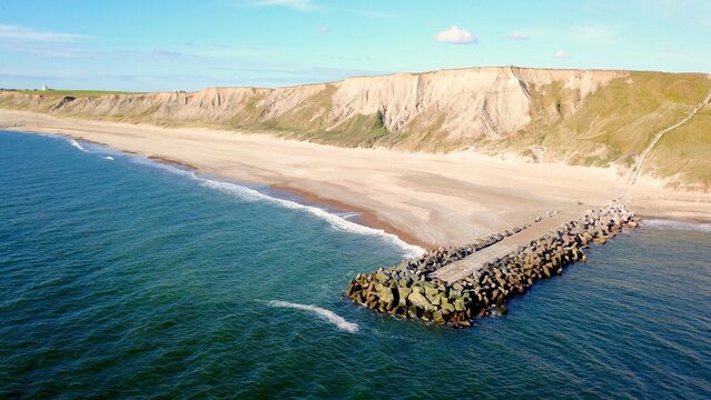 Cliffs, groyne and stairs on the coast of Bovbjerg Fyr at Ferring near Lemvig, Midtjylland region in western Denmark, high quality aerial view image