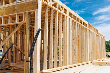 New residential construction home framing wooden construction against a blue sky
