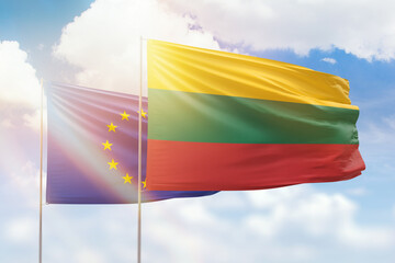 Sunny blue sky and flags of lithuania and european union