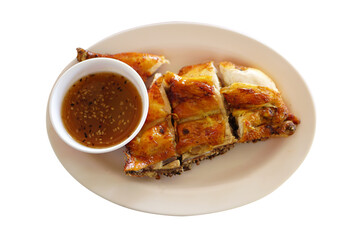 Grilled chicken with dipping sauce on a plate