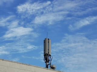 Wireless communication transmitter on the rooftop. Selective focus.