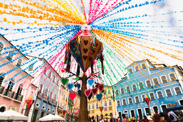 Colorful flags and balloons decorating the feast of Sao Joao in the historic center of Salvador,...