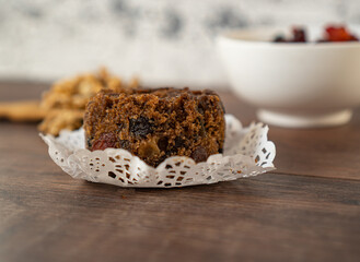 an individual portion of cake on a wooden table.