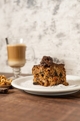 a slice of cake with a delicious cappuccino