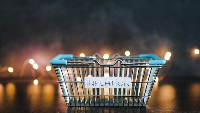 economy after covid, inflation text on empty shopping basket  on dark background with lights