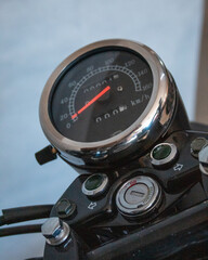 Motorcycle parts: engine, gears, wheels and chain.