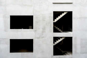 concrete wall under construction. Empty buildings.