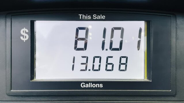 Fuel gas increased cost due to economy inflation. Gas station fuel meter counter price. Close up car refueling by increasing petrol costs. Digital counter count up, gas pump, rising gas prices in USA