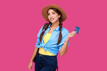 Caucasian woman holding credit card isolated on pink background. Online shopping, e-commerce, internet banking, spending money, enjoying life concepts