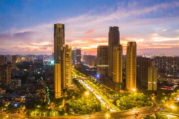 Fototapeta na wymiar Haikou Cityscape in the Dayingshan District, with Landmark Buildings and Sunset Glow, Hainan Province, the Largest Free Trade Zone in China.