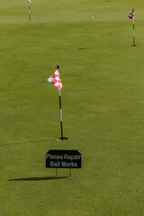 Obraz premium Stockholm, Sweden A putting green at a golfcourse and a sign saying: 